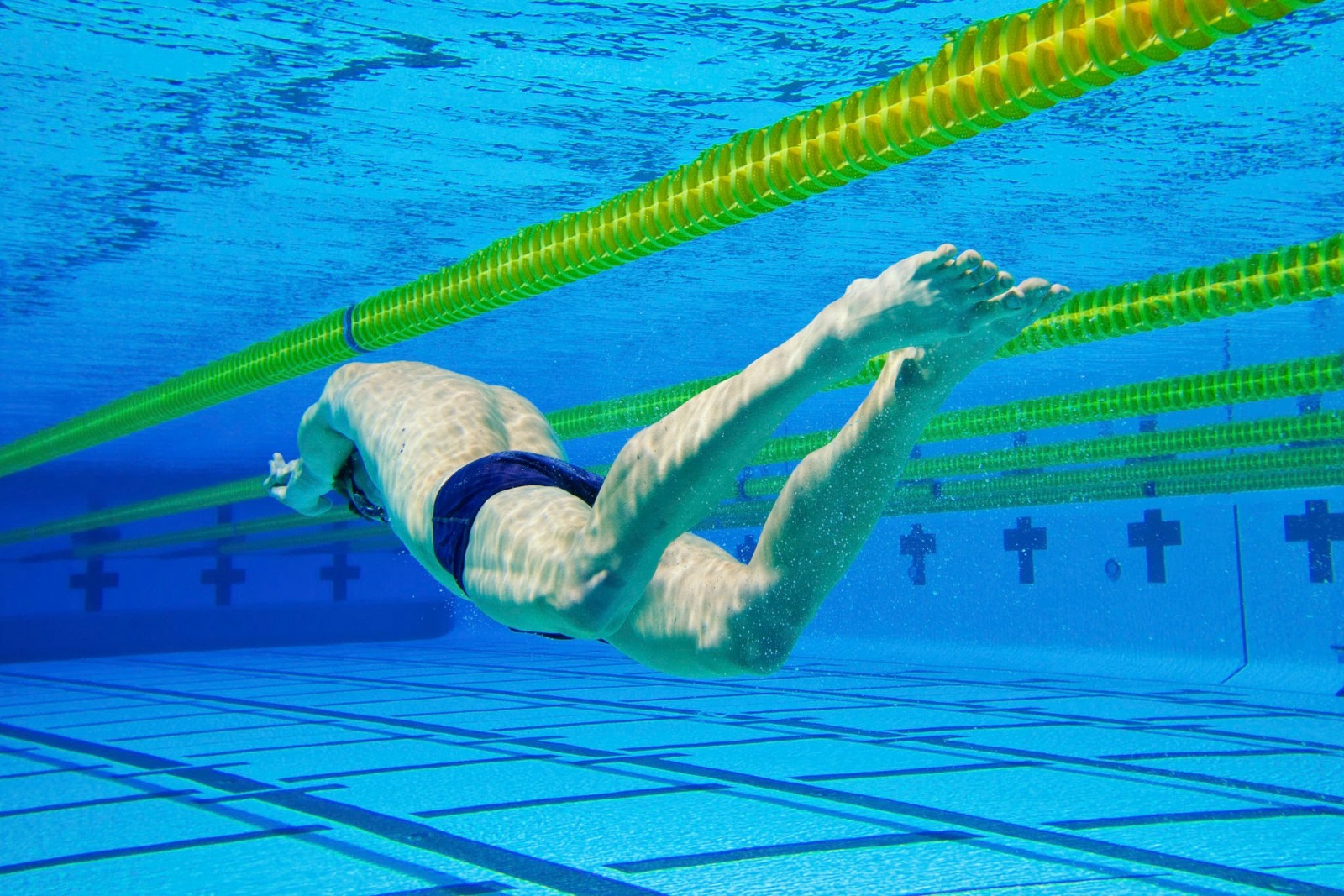 "The Dolphin Kick: Why Swimmers Move Faster Underwater than on The Surface of the Water"